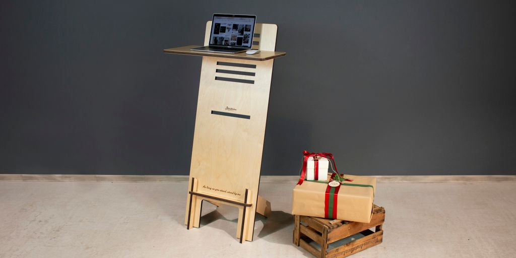 a wooden tower with a laptop on top of it